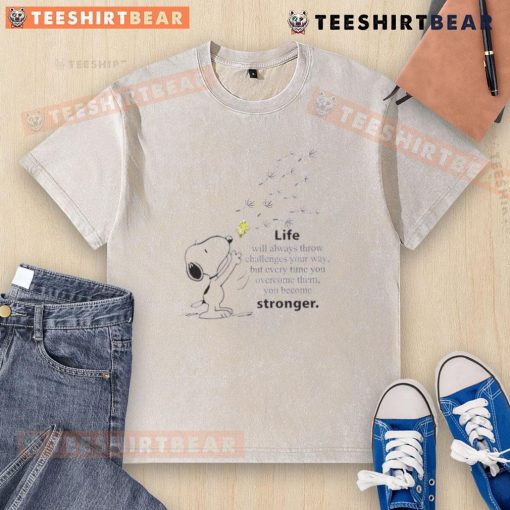 Cute Snoopy graphic on a washed t-shirt with the quote about overcoming challenges and becoming stronger.