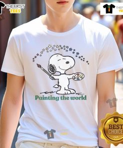 Alt Text: Cute Snoopy painting the world graphic on a stylish t-shirt, perfect for fans of Peanuts and unique art apparel.