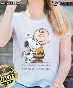 Alt Text: Cute Snoopy Peanuts tee with quote 'Your behavior decides who stays in your life' for ladies' fashion.