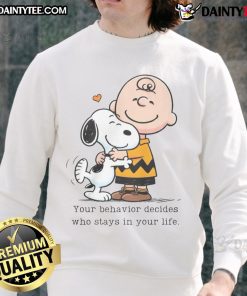 Alt Text: Cute Snoopy Peanuts sweatshirt with the quote 'Your behavior decides who stays in your life' in colorful design.