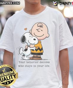 Alt Text: Cute Snoopy Peanuts t-shirt with the phrase Your Behavior Decides Who Stays In Your Life in vibrant colors.