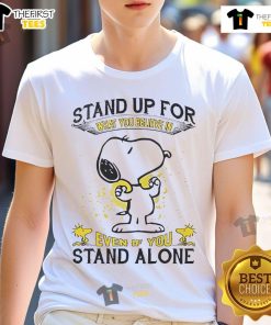 Alt Text: Cute Snoopy t-shirt featuring Stand Up For What You Believe In Even If You Stand Alone design.