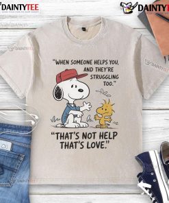 Alt Text: Cute Snoopy graphic on a washed T-shirt, showcasing love and support when helping others in tough times.
