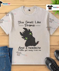 Alt Text: Cute Toothless graphic on a washed t-shirt saying 'You smell like drama and a headache, please get away from me.'
