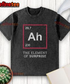 Funny 'Ah! The Element of Surprise' washed t-shirt displayed on a wooden background, perfect for humor lovers.