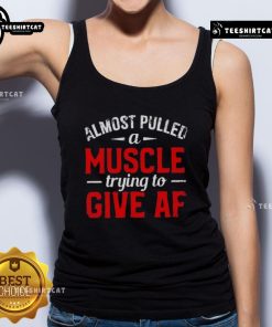 Funny moment of someone almost pulling a muscle while trying to give a tank top, showcasing a humorous fashion struggle.