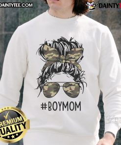 Funny mom in a messy bun wearing a sweatshirt, embodying mom life with her boys, showcasing motherhood humor.