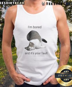Funny cat in a tank top with a bored expression, captioned 'I'm bored and it's your fault,' perfect for cat lovers.