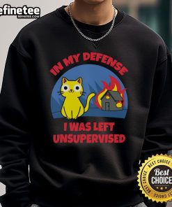 Alt Text: Funny cat in In My Defense I Was Left Unsupervised sweatshirt beside a burning house, showcasing humor and mischief.