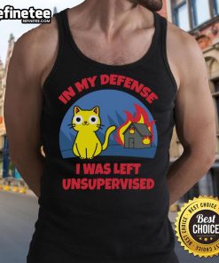 Funny cat in 'In My Defense I Was Left Unsupervised' tank top inside a burning house, showcasing humor and chaos.