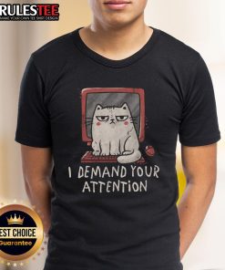 Funny cat on a keyboard with a playful expression, featured on a I Demand Your Attention T-shirt design.