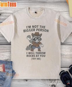Funny cowboy raccoon on a washed T-shirt with the phrase I'm not the bigger person, I will throw rocks at you.