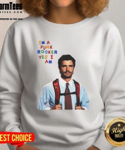 Alt Text: David Corenswet wearing a 'I'm A Punk Rocker Yes I Am' sweatshirt, showcasing a humorous punk style.