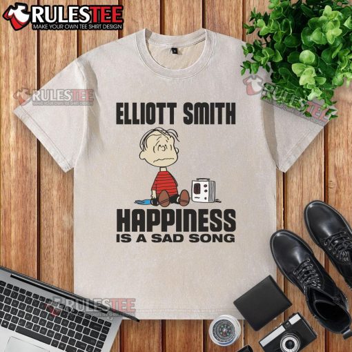 Funny Elliott Smith 'Happiness Is A Sad Song' Peanuts washed t-shirt featuring iconic cartoon characters and vibrant colors.