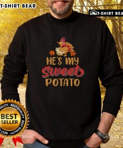 Funny Thanksgiving sweatshirt featuring 'He's My Sweet Potato' turkey design, perfect for holiday celebrations.