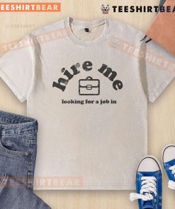 Funny 'Hire Me' job seeker in a washed t-shirt, showcasing humor and personality in a job search image.