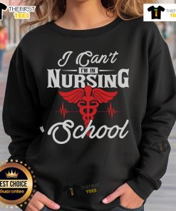 Funny 'I Can't I'm in Nursing School' sweatshirt design featuring playful text, perfect for nursing students and gifts.