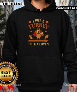 Funny Thanksgiving hoodie with 'I Put A Turkey In That Oven' design, perfect for holiday celebrations and gatherings.