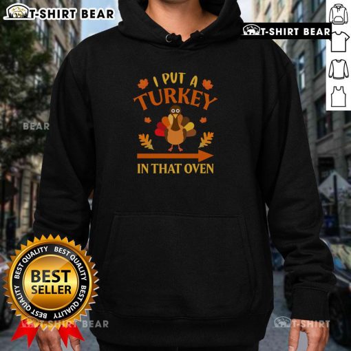 Funny Thanksgiving hoodie with 'I Put A Turkey In That Oven' design, perfect for holiday celebrations and gatherings.