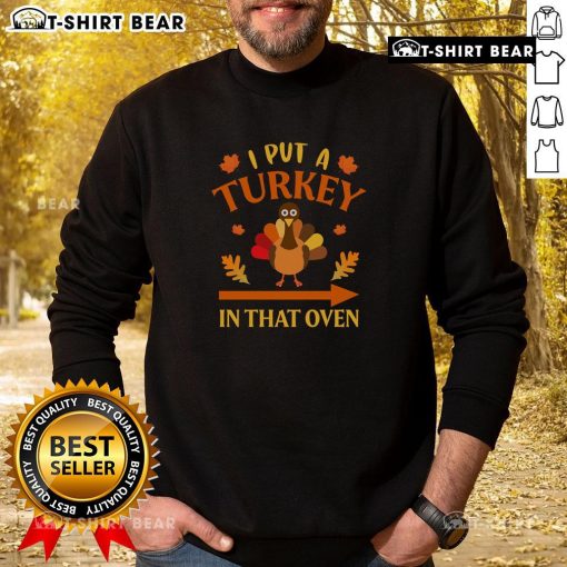 Funny Thanksgiving sweatshirt featuring 'I Put A Turkey In That Oven' design, perfect for holiday gatherings.