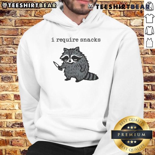 Alt Text: Raccoon in a hoodie holding a knife with a humorous expression, captioned Funny I Require Snacks for hoodie lovers.
