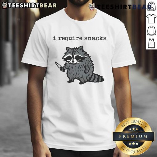 Funny I Require Snacks raccoon t-shirt featuring a playful raccoon with a knife, perfect for animal lovers and snack enthusiasts.