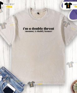 Funny I'm A Double Threat Mommy And Daddy Issues washed cotton t-shirt displayed on a hanger, perfect for casual wear.