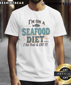 Funny seafood diet t-shirt design with the phrase I'm on a seafood diet I see food & eat it in playful typography.