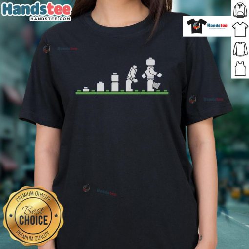 Funny Lego human evolution graphic on a ladies tee, showcasing playful designs with Lego characters and humor.