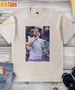 Funny Medvedev licking ice cream on the field at US Open in a washed t-shirt, showcasing his playful side.