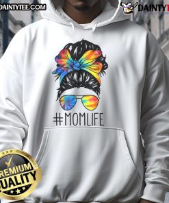Mom in a tie-dye hoodie, sporting a funny messy hair bun, celebrating Mother's Day with a smile and playful spirit.
