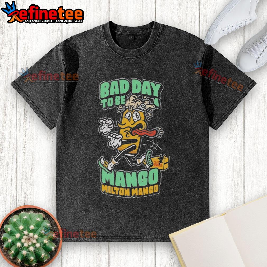 Funny Milton Mango Bad Day To Be A Mango Washed T Shirt Funny Milton Mango graphic on a washed t-shirt, humorously depicting a bad day to be a mango.