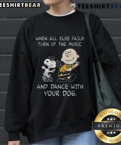 Alt Text: Funny Peanuts Snoopy sweatshirt featuring 'When all else fails, turn up the music and dance with your dog' design.