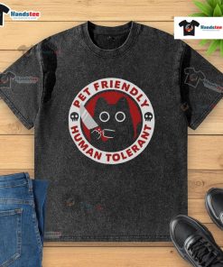 Funny pet-friendly human tolerant killer cat design on a washed t-shirt, perfect for cat lovers and humor enthusiasts.