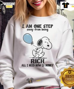 Alt Text: Funny Snoopy sweatshirt with text 'I Am One Step Away From Being Rich, All I Need Now Is Money' in vibrant colors.