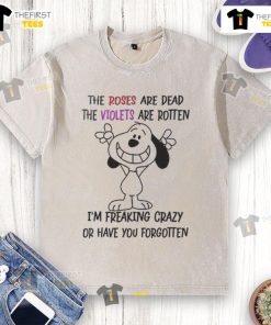 Funny Snoopy t-shirt with the quote 'I'm talking in English and you're listening in stupidity' on a casual design.