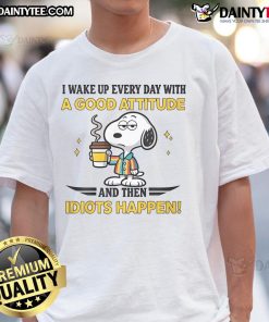 Funny Snoopy t-shirt featuring the phrase 'I Wake Up Everyday With A Good Attitude And Then Idiots Happen' in vibrant colors.