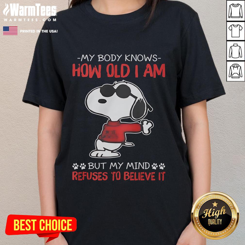 Funny Snoopy My Body Knows How Old I Am But My Mind Refuses To Believe It Ladies-Tee Funny Snoopy tee featuring 'My body knows how old I am, but my mind refuses' - perfect for humor-loving ladies.