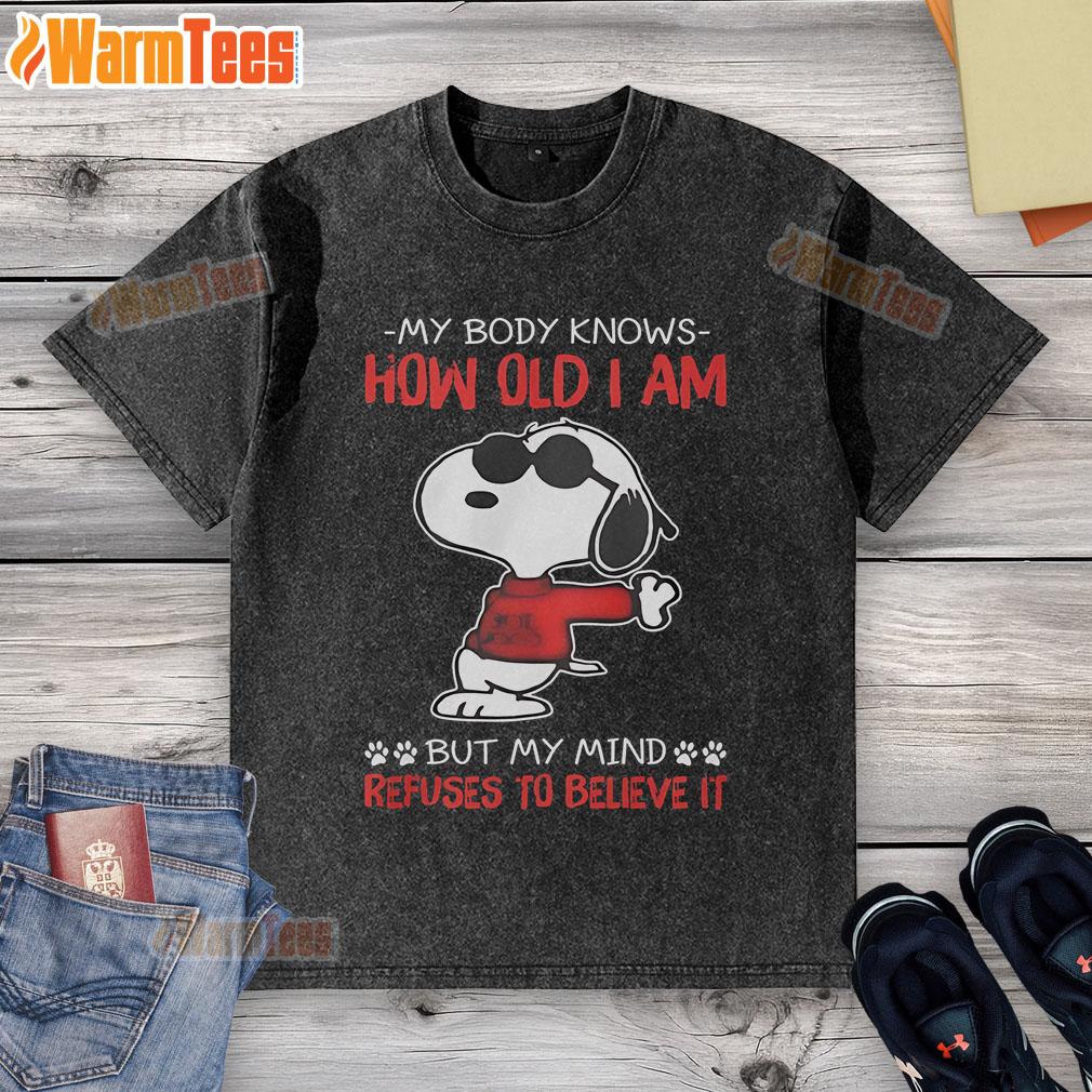 Funny Snoopy My Body Knows How Old I Am But My Mind Refuses To Believe It Washed T-Shirt Funny Snoopy 'My Body Knows How Old I Am' washed t-shirt showcasing a playful design and vibrant colors.