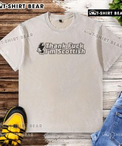 Alt Text: Funny Thank F* I'm Scottish washed t-shirt design featuring bold text on a casual shirt. Perfect for proud Scots!