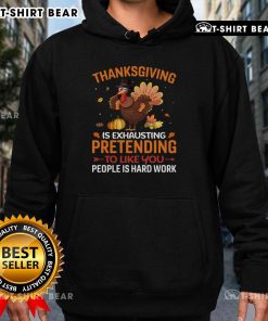 Alt Text: Funny Thanksgiving hoodie featuring the phrase Pretending to like you people is hard work for humor lovers.