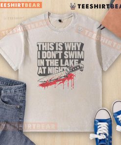 Funny 'This Is Why I Dont Swim In The Lake At Night' t-shirt with killer knife graphic, perfect for humor lovers.