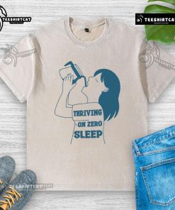 Funny 'Thriving on Zero Sleep' coffee washed t-shirt design featuring a humorous coffee cup graphic.