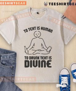 Funny washed t-shirt featuring 'To text is human, to drunk text is divine' slogan, perfect for humorous casual wear.