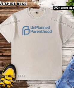 Funny unplanned parenthood washed t-shirt featuring humorous quotes about parenting challenges and surprises.