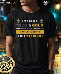 Alt Text: Cleveland Cavaliers fan wearing a wine and gold t-shirt that says 'I Wear My Wine And Gold Year Round' showcasing team pride.