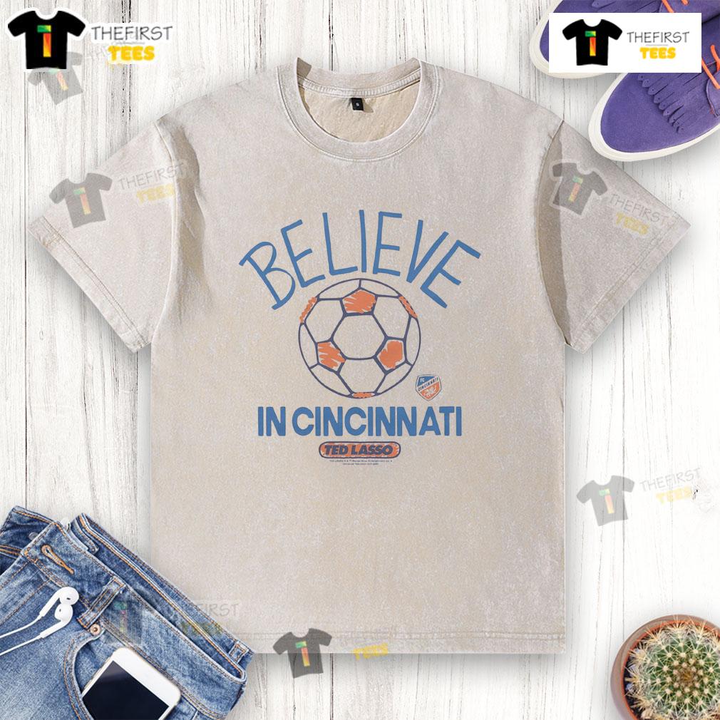 Good Fc Cincinnati Homage Mls X Ted Lasso Believe Washed T Shirt Good FC Cincinnati Homage MLS x Ted Lasso Believe Washed T-Shirt featuring a vintage design and team colors.