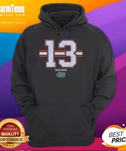 Alt Text: Jadan Baugh wearing a Florida Gators football hoodie, number 13, showcasing team colors and striped design.