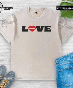 Good Frequency Festival I Love Traisen washed t-shirt displayed on a hanger, showcasing vibrant colors and trendy design.