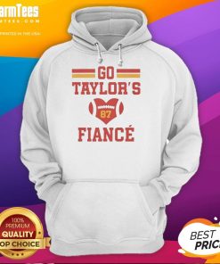 Alt Text: Taylor Swift's fianc Travis Kelce in a cozy hoodie featuring heart design and number 87, perfect for football fans.